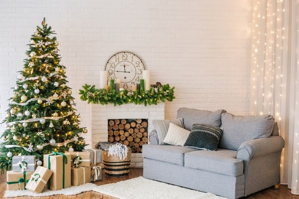Beautiful holiday decorated living room with Christmas tree and gifts under it